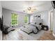 Bright bedroom with wood floors, ceiling fan and neutral walls and large windows at 4648 Fringetree Dr. # C, Murrells Inlet, SC 29576