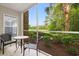 Relaxing screened porch overlooking lush greenery and a golf course at 4648 Fringetree Dr. # C, Murrells Inlet, SC 29576