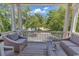 Relaxing balcony features comfortable seating, providing an idyllic spot for outdoor enjoyment at 48 Half Shell Ct., Litchfield, SC 29585