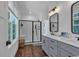 Bright bathroom features a double vanity, modern fixtures, and a glass-enclosed shower at 48 Half Shell Ct., Litchfield, SC 29585