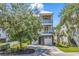 Charming two-story home features a double garage, balconies, and manicured landscaping at 48 Half Shell Ct., Litchfield, SC 29585