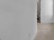 Hallway with a carpet floor, light grey walls, and a view to the bathroom at 48 Half Shell Ct., Litchfield, SC 29585