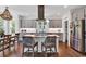 Modern kitchen features a central island, stainless steel appliances, and stylish light fixture at 48 Half Shell Ct., Litchfield, SC 29585