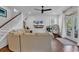 Inviting living room with wood floors, ship lap accent wall, neutral colors, and ample natural light at 48 Half Shell Ct., Litchfield, SC 29585