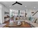 Spacious living room with a comfortable sectional couch, seamlessly connected to the kitchen and dining area at 48 Half Shell Ct., Litchfield, SC 29585
