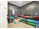 Convenient storage room with dark paneled walls for keeping sporting goods and outdoor equipment at 48 Half Shell Ct., Litchfield, SC 29585