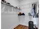 Walk-in closet provides wire shelving for storage, with wood floor and white walls at 48 Half Shell Ct., Litchfield, SC 29585