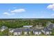 Aerial shot of 480 River Oaks Dr condos surrounded by verdant trees and other condos at 480 River Oaks Dr. # 63-O, Myrtle Beach, SC 29579
