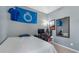 Cozy bedroom with computer desk, gaming chair, mirror and natural light at 480 River Oaks Dr. # 63-O, Myrtle Beach, SC 29579