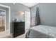 Neutral bedroom features dresser, lamp, window, and plush carpeting at 480 River Oaks Dr. # 63-O, Myrtle Beach, SC 29579