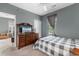 Comfortable bedroom with dresser, television, and ceiling fan for added convenience at 480 River Oaks Dr. # 63-O, Myrtle Beach, SC 29579