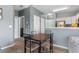 Cozy dining area features seating for four, adjacent to the bright and functional kitchen at 480 River Oaks Dr. # 63-O, Myrtle Beach, SC 29579