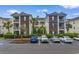 Beautiful condo with brick accents, private balcony, and well-maintained landscaping at 480 River Oaks Dr. # 63-O, Myrtle Beach, SC 29579