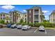 View of exterior and parking for this lovely condo community with lush landscaping at 480 River Oaks Dr. # 63-O, Myrtle Beach, SC 29579