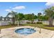 Community hot tub with palm trees, landscaping, and nearby apartment buildings at 480 River Oaks Dr. # 63-O, Myrtle Beach, SC 29579