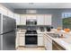 Charming kitchen with stainless steel appliances, white cabinets, and modern countertops at 480 River Oaks Dr. # 63-O, Myrtle Beach, SC 29579