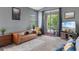 Comfortable living room with large windows and sliding glass doors leading to a balcony at 480 River Oaks Dr. # 63-O, Myrtle Beach, SC 29579