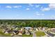 Panoramic aerial shot shows the house is nestled within a leafy neighborhood, offering serene suburban living at 482 Pomo Dr., Myrtle Beach, SC 29579