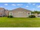 Expansive backyard with verdant grass, manicured shrubs creating an inviting outdoor space at 482 Pomo Dr., Myrtle Beach, SC 29579