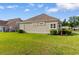 Lush backyard features well-maintained lawn, with neatly trimmed shrubs enhancing the property's appeal at 482 Pomo Dr., Myrtle Beach, SC 29579
