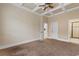 A welcoming bedroom with a coffered ceiling leading to a bathroom and hallway at 482 Pomo Dr., Myrtle Beach, SC 29579