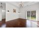Charming dining room featuring hardwood floors, wainscoting, and a sliding glass door at 482 Pomo Dr., Myrtle Beach, SC 29579