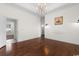 Charming dining room featuring hardwood floors, wainscoting detail and a chandelier at 482 Pomo Dr., Myrtle Beach, SC 29579
