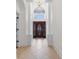 Elegant foyer with columns and an arched transom over the front door, offering a glimpse of the sky at 482 Pomo Dr., Myrtle Beach, SC 29579