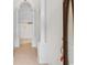 Bright hallway featuring elegant columns, tile flooring, and a view of a decorative light fixture at 482 Pomo Dr., Myrtle Beach, SC 29579