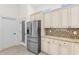 Bright kitchen with stainless steel fridge, granite counters, and light wood cabinetry at 482 Pomo Dr., Myrtle Beach, SC 29579