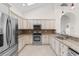 Bright kitchen with stainless steel appliances, granite countertops, mosaic backsplash, and ample storage at 482 Pomo Dr., Myrtle Beach, SC 29579