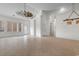 Spacious living room with tile flooring, decorative ceiling fan and unique light fixture at 482 Pomo Dr., Myrtle Beach, SC 29579