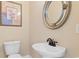 The home's powder room features a decorative mirror, pedestal sink and commode at 482 Pomo Dr., Myrtle Beach, SC 29579