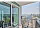 Balcony view overlooking the beach and cityscape with comfortable seating at 504 N Ocean Blvd. # 1810, Myrtle Beach, SC 29577