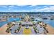 Aerial view of a community clubhouse with a pool, tennis courts, and beautiful landscaping surrounded by lakes and homes at 5049 Middleton View Dr., Myrtle Beach, SC 29579