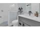 Bathroom featuring subway tile and gray vanity cabinet providing optimal storage at 5049 Middleton View Dr., Myrtle Beach, SC 29579