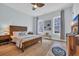 Well-lit bedroom with a ceiling fan, a bed and matching nightstand and dresser at 5049 Middleton View Dr., Myrtle Beach, SC 29579