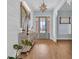 Elegant entryway features shiplap walls, a wooden console table, and a view of the front door at 5049 Middleton View Dr., Myrtle Beach, SC 29579