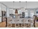 Stylish kitchen island featuring bar seating, pendant lights, and modern appliances at 5049 Middleton View Dr., Myrtle Beach, SC 29579