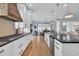 Modern kitchen features white cabinets, stainless steel appliances and view to dining area at 5049 Middleton View Dr., Myrtle Beach, SC 29579