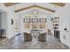 Bright sunroom with vaulted ceilings, exposed beams, herringbone tile floors and a bar area at 5049 Middleton View Dr., Myrtle Beach, SC 29579