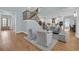Open-concept living area with hardwood floors, staircase, and a view of the modern kitchen at 5049 Middleton View Dr., Myrtle Beach, SC 29579