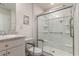 Well-lit bathroom featuring a glass shower and a modern vanity at 509 Wildfire Ct., Longs, SC 29568