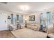 Bright living room with cozy seating, large windows, and elegant decor at 509 Wildfire Ct., Longs, SC 29568