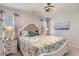 Comfortable bedroom with stylish bedding, ceiling fan, and ample natural light at 509 Wildfire Ct., Longs, SC 29568