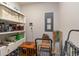 Organized storage area with shelving, bins, and rolling cart for various supplies and equipment at 509 Wildfire Ct., Longs, SC 29568