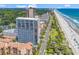 Aerial view of condo community near the beach with a pool and other amenities at 5511 N Ocean Blvd. # 209, Myrtle Beach, SC 29577