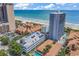 Ocean view from a high-rise condo building with parking garage and community pool at 5511 N Ocean Blvd. # 209, Myrtle Beach, SC 29577