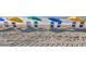 Charming beach view with colorful umbrellas and chairs, perfect for a relaxing day in the sun at 5511 N Ocean Blvd. # 209, Myrtle Beach, SC 29577