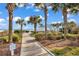 Walkway leads to a gazebo surrounded by lush greenery and offers a serene beach view at 5511 N Ocean Blvd. # 209, Myrtle Beach, SC 29577
